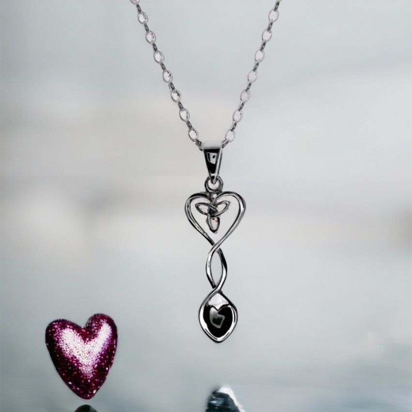 Sterling Silver Welsh Love Spoon Pendant with Trinity Knot, shown by a pink heart. 