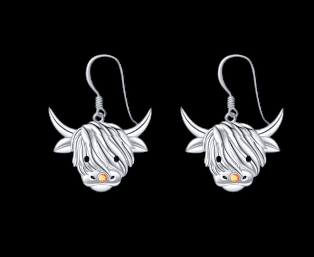 Sterling silver Scottish Highland Cow earrings, handcrafted Scottish jewelry gift, made in Scotland, shown on black