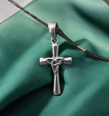 Sterling Silver Celtic Cross with Central Trinity Knot on Green Fabric. 