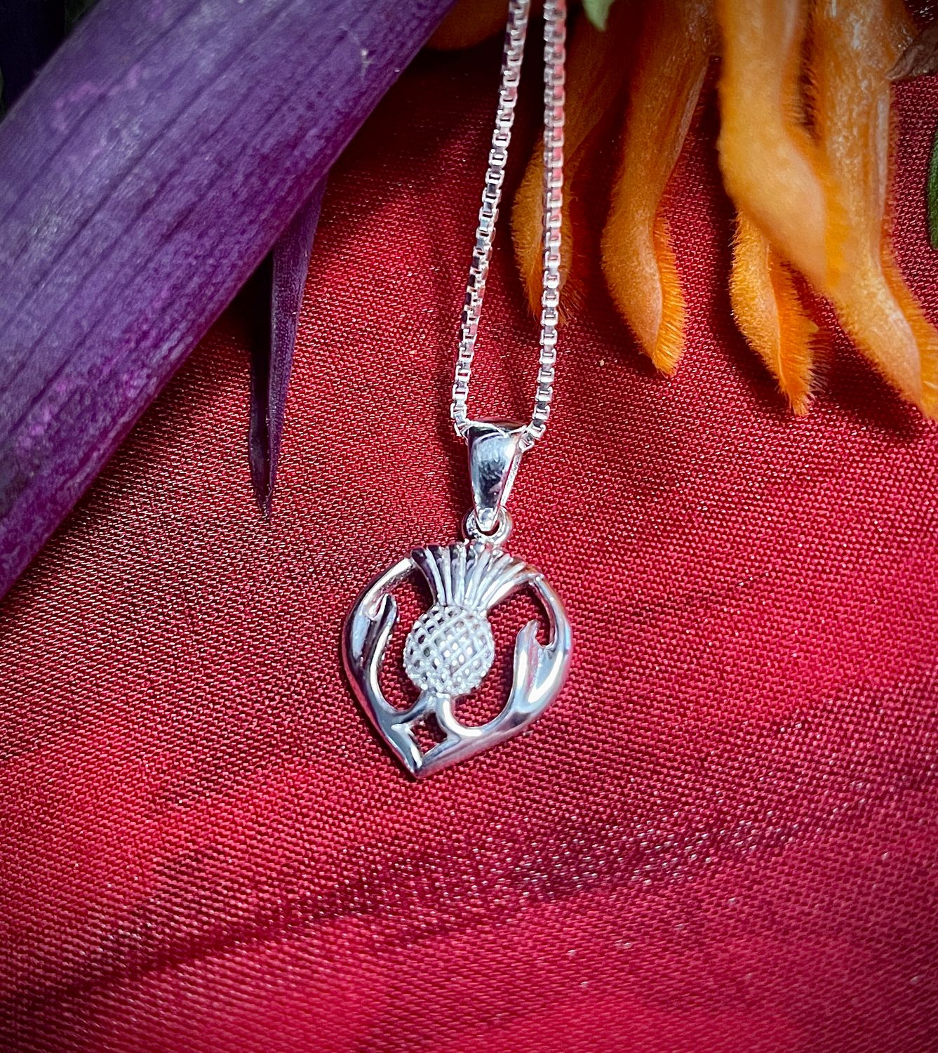 Sterling silver Scottish thistle pendant necklace, symbol of Scotland and Celtic heritage.