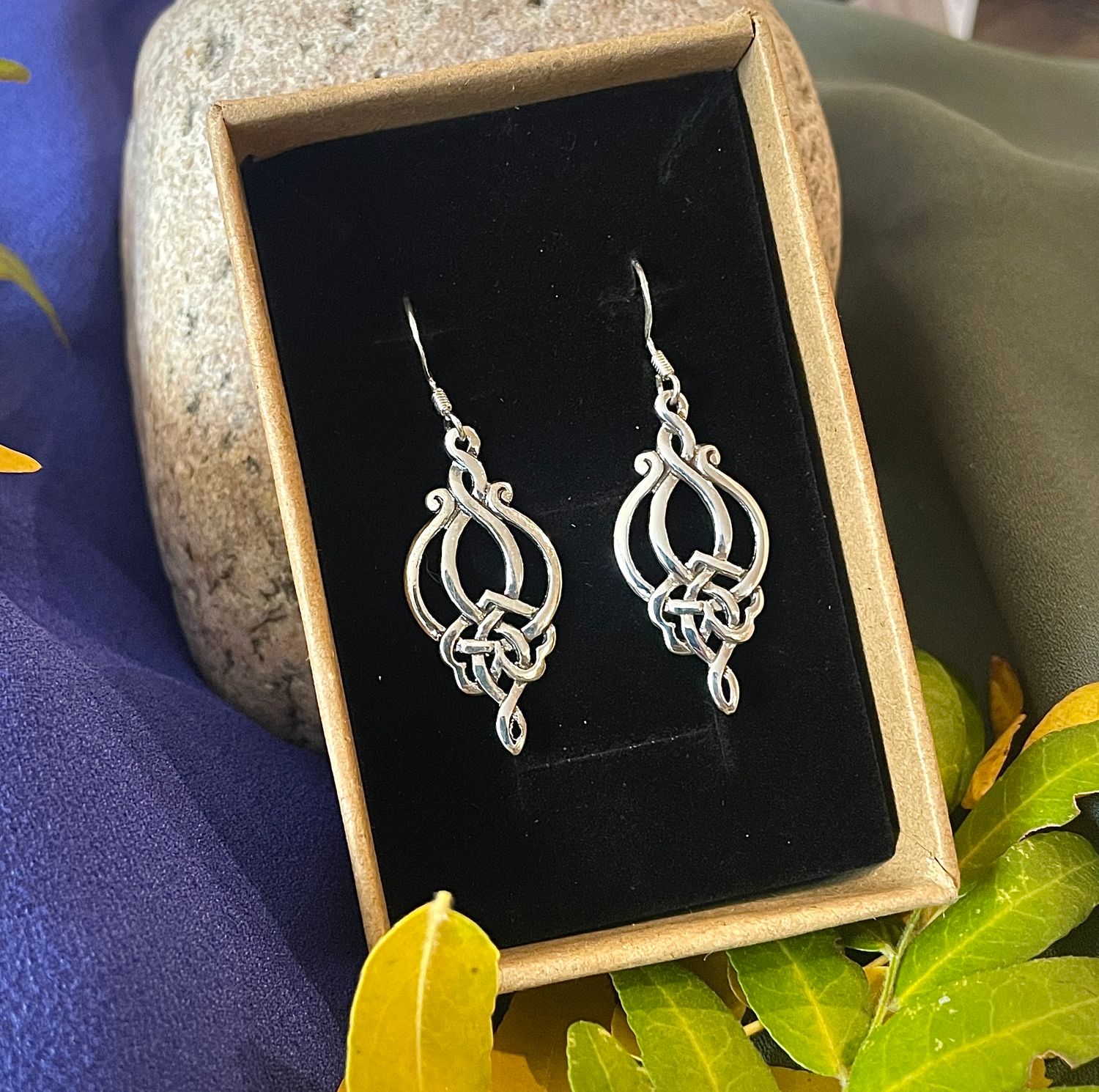 Sterling silver Celtic knotwork drop earrings, handcrafted Celtic jewelry with intricate design, shown in jewelry box. 