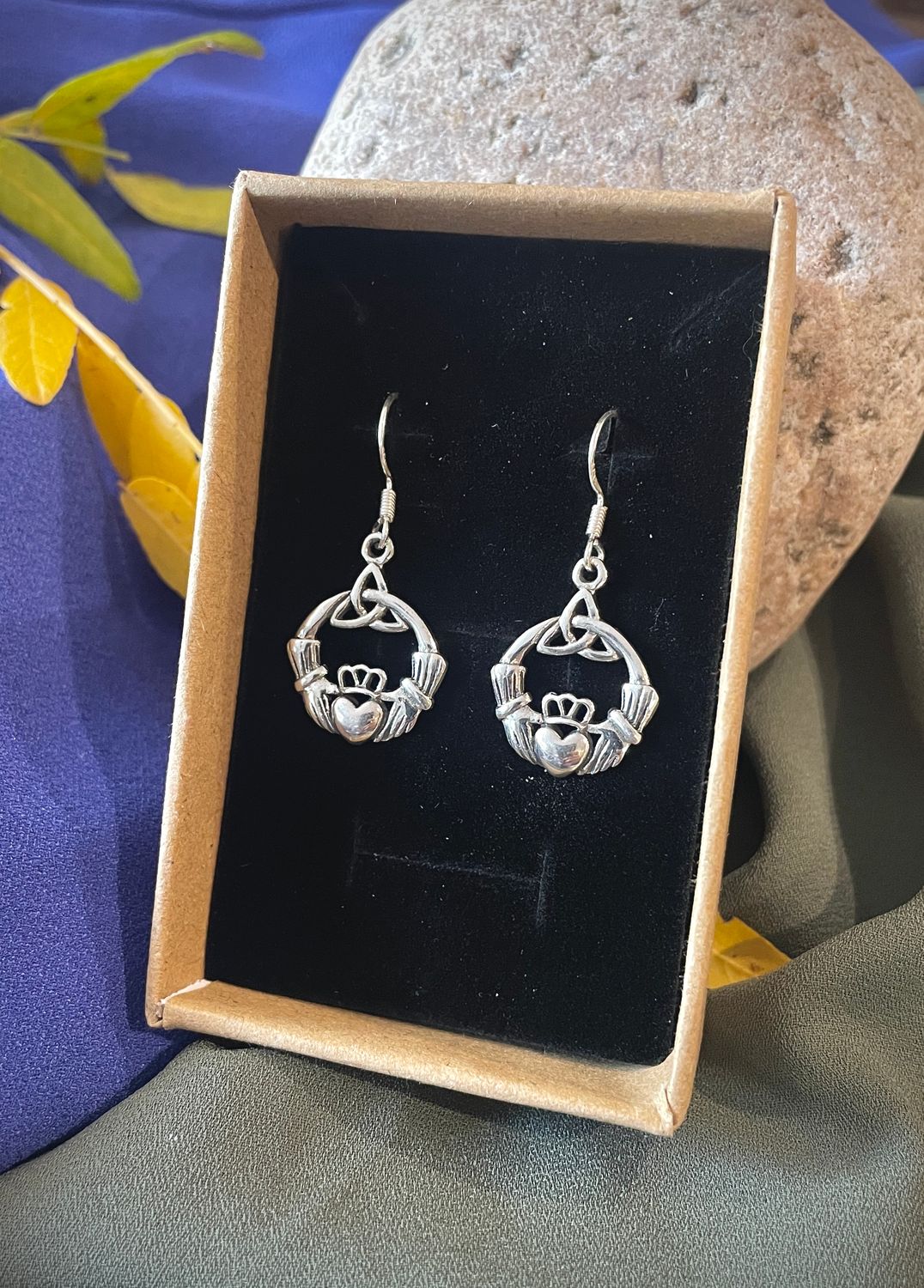 Sterling silver Irish Claddagh earrings featuring the traditional hands, heart, and crown design symbolizing love, loyalty, 