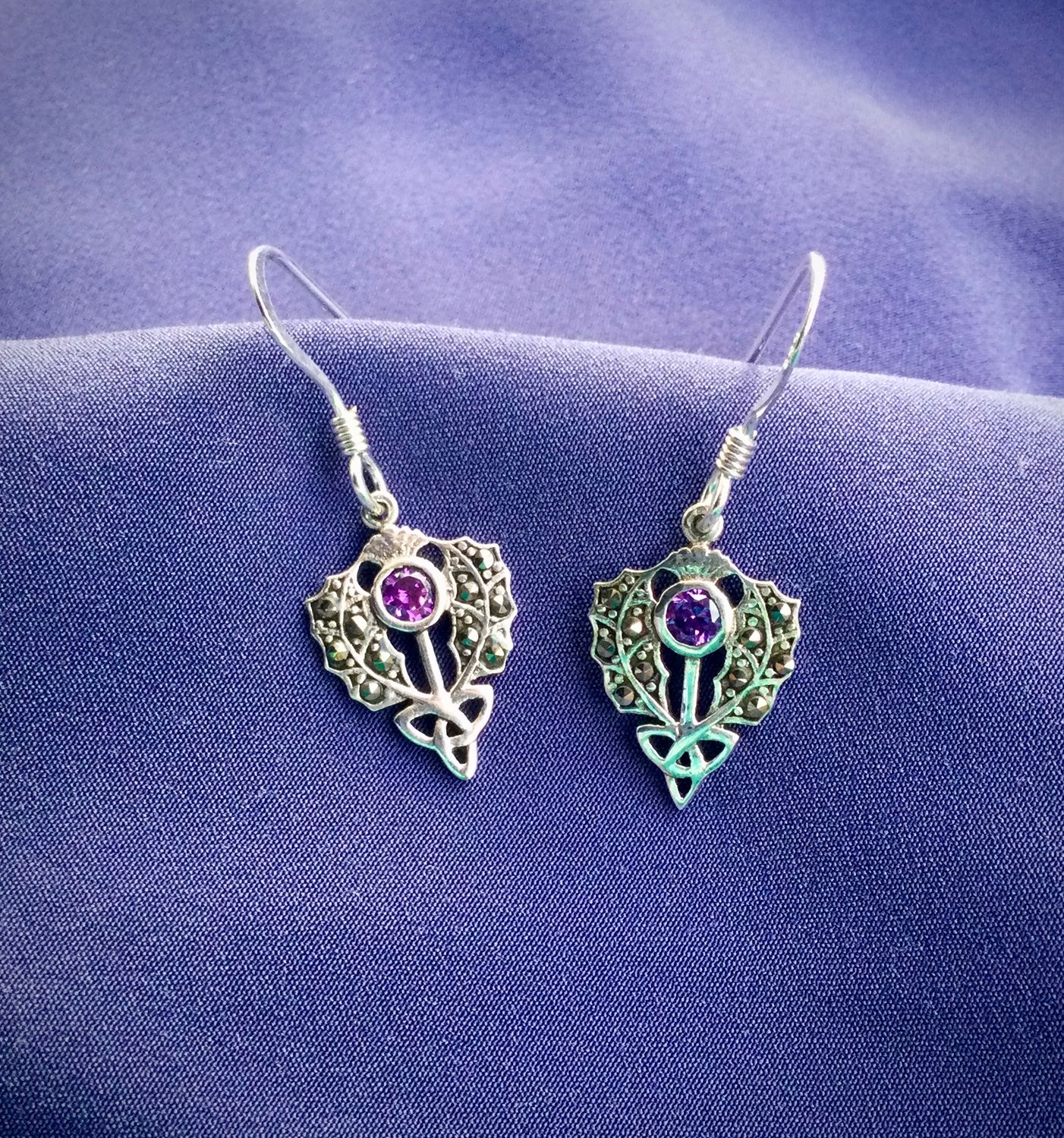 Sterling silver Scottish thistle drop earrings with trinity knot design and central marcasite stone.
