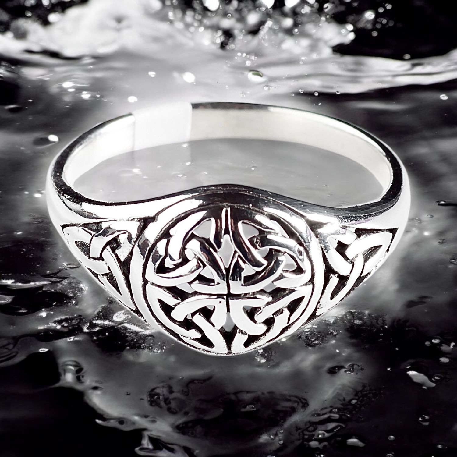 Trinity Knot Sterling Silver Celtic Ring on Water background